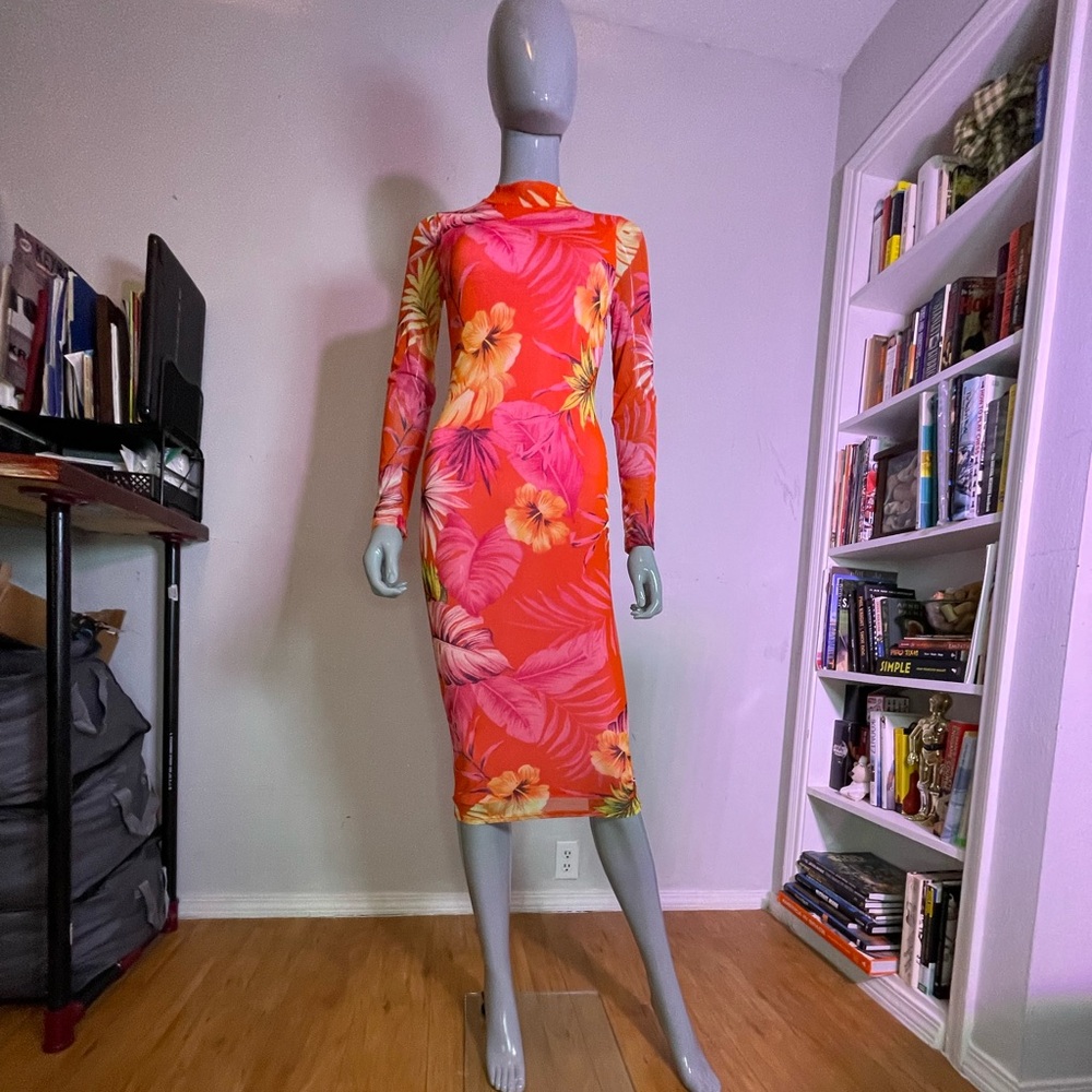 Vibrant,long sleeve maxi dress. Polyester/spandex. Form fitting, good stretch.